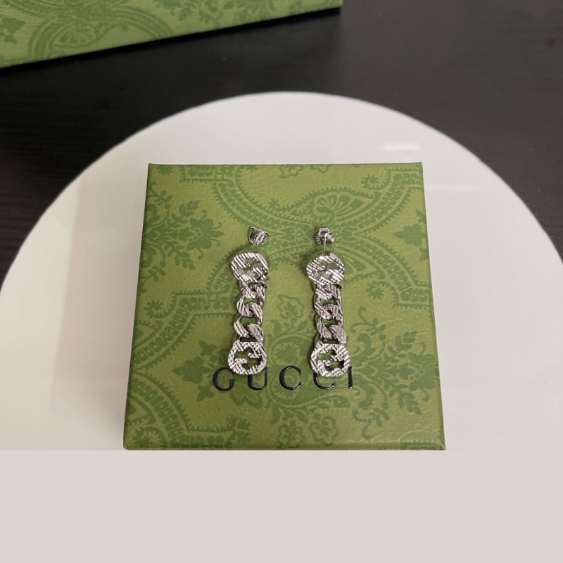 G*u*i earrings